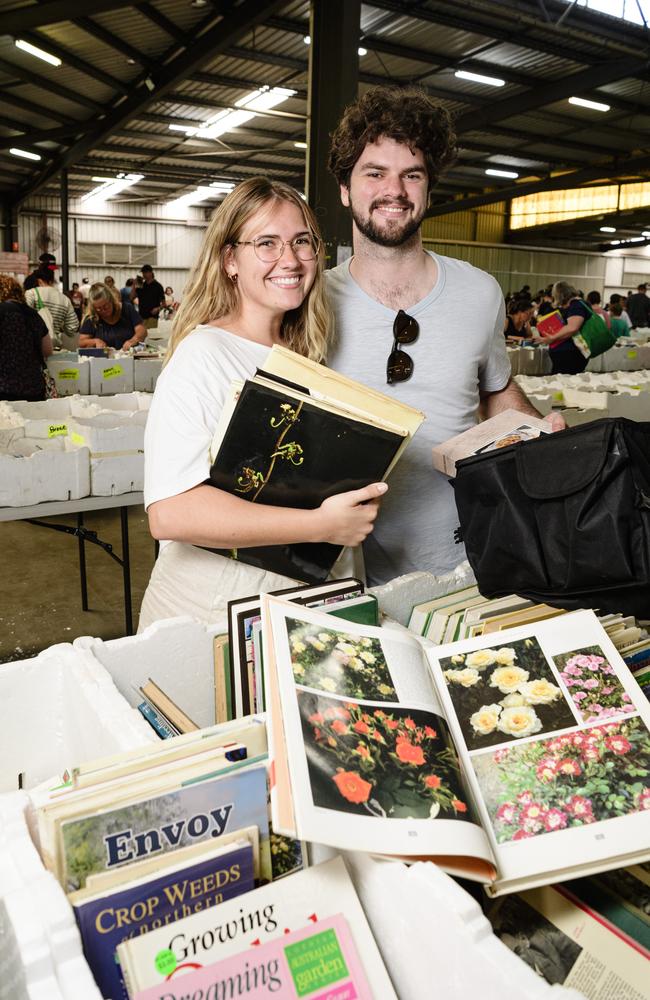 Belle Clark and Darby Waters check out The Chronicle Lifeline Bookfest after recently relocating to the city, Saturday, March 1, 2025. Picture: Kevin Farmer