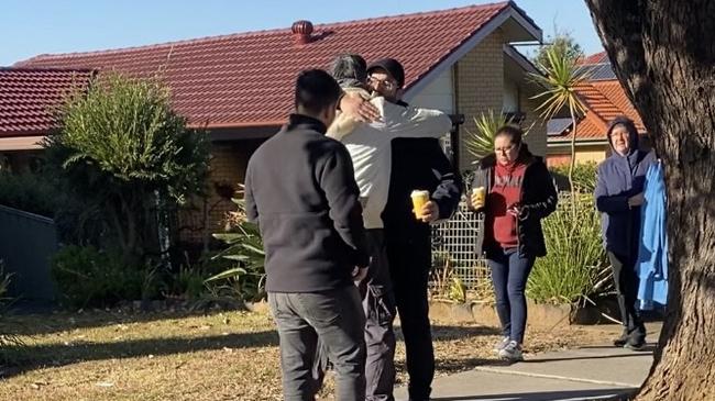 A family are seen comforting each other after the tragedy. Picture: Kirsten Jelinek