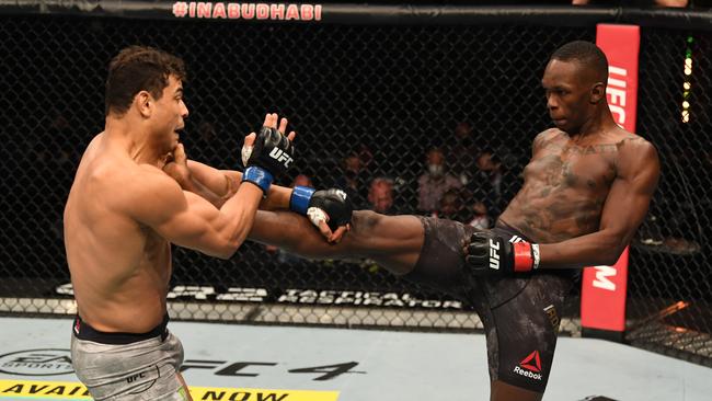 Israel Adesanya of Nigeria kicks Paulo Costa of Brazil in their middleweight championship bout during UFC 253. Picture: Getty Images