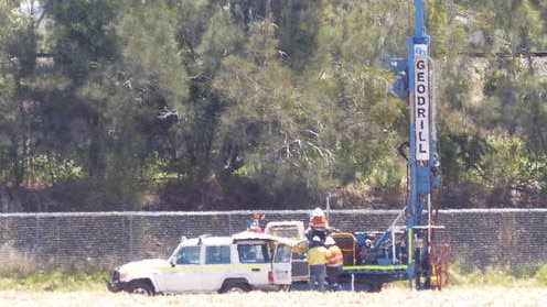 Workers on site near the Coomera River planning for the Coomera Connector.