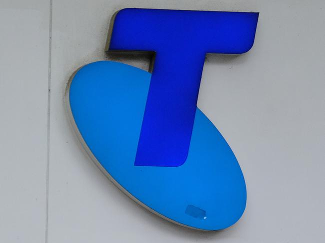 MELBOURNE, AUSTRALIA - NewsWire Photos OCTOBER 4, 2022. Generic photo people walking past the Telstra logo in Melbourne..Picture: NCA NewsWire / Luis Enrique Ascui