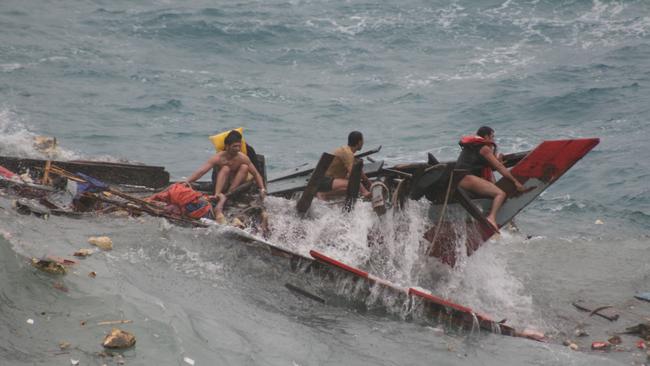 Asylum boat SIEV 221 after it crashed into rocks at Christmas Island. Picture: Amy Rossbach and Allan Krepp