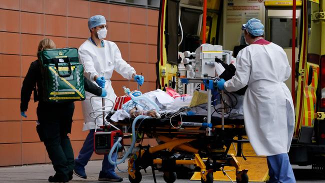 Medics take a patient from an ambulance into the Royal London hospital on January 19. Picture: AFP