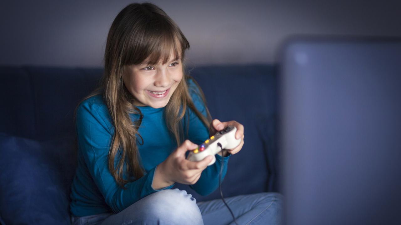 Little girl playing video games