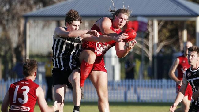 Two Wells star Jakob Thomson takes a strong mark. Picture: Peter Argent