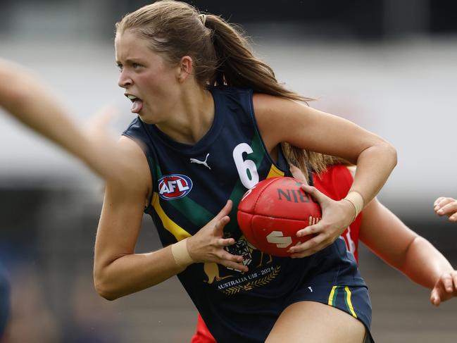 MELBOURNE, AUSTRALIA - APRIL 06:  Sara Howley of the AFL National Academy Girls runs with the ball during the Marsh AFL National Academy Girls vs U23 All-Stars at Ikon Park on April 06, 2024 in Melbourne, Australia. (Photo by Darrian Traynor/AFL Photos/via Getty Images)