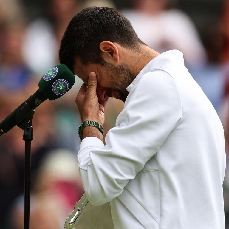 Novak Djokovic was in tears. (Photo by Adrian DENNIS / AFP)