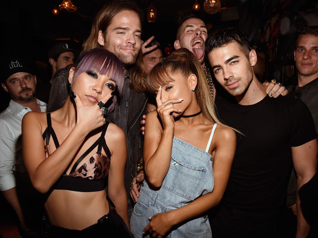 JinJoo Lee, Jack Lawles, Cole Whittle, and Joe Jonas of DNCE pose with singer Ariana Grande during the 2016 MTV Video Music Awards Republic Records After Party in New York City. Picture: Getty