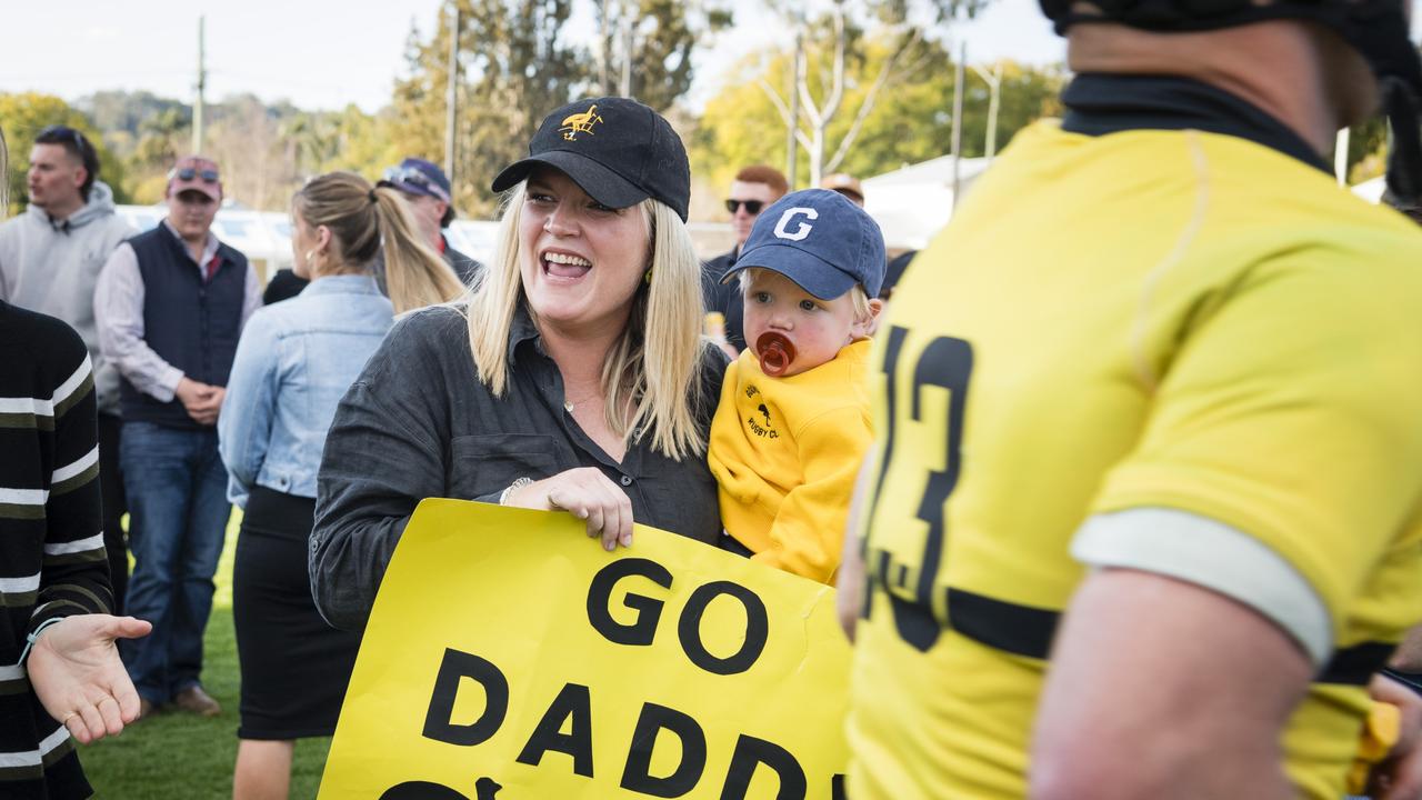 Emily and George Cook cheer on husband and father Jack Cook as Goondiwindi Emus take to the field against Toowoomba Rangers in the Risdon Cup grand final. Picture: Kevin Farmer