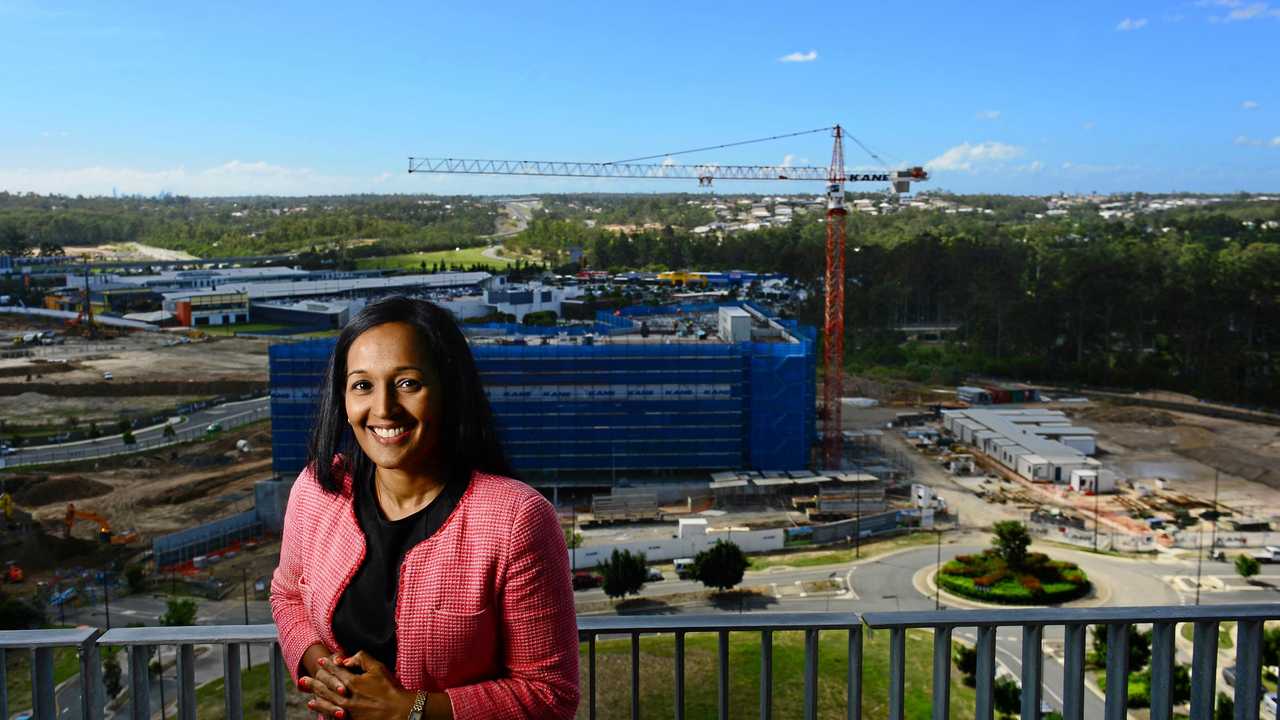 GROWTH: Springfield Land Corporation managing director Raynuha Sinnathamby stands before the changing landscape of Springfield. Picture: David Nielsen