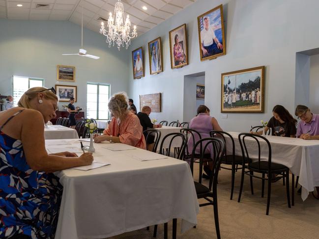 People flowed through the Government house on Saturday to write a condolence message and pay their respects to the passing of the Queen. Picture: Floss Adams.