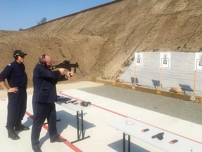 NSW Police Minister David Elliott firing a Heckler and Koch UMG 40 and a Glock pistol at John Morony Correctional Centre in November 2018. Picture: Facebook