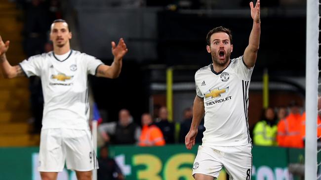 Juan Mata of Manchester United appeals to an assistant referee after his disallowed goal against Crystal Palace.