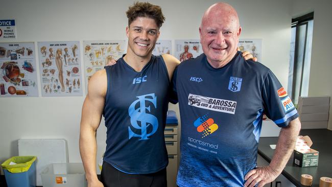 Sturt footballer Tom Lewis with head trainer Nick Swingler AOM. Picture: Mark Brake