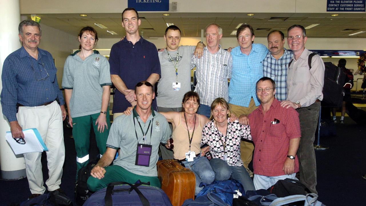 Medicos and specialists leaving Australia to help in Indonesia: Dr Roger Capps, Paramedic Debbie Harrop, Andrew Pearce, Daniel Martin, Garry Clarke, Tony Farror, Paul Miller, Dr Frank Bridgewater. (Front row) David Tingey, Heather Dodd, Joy Booth and Dr Tim Semple.