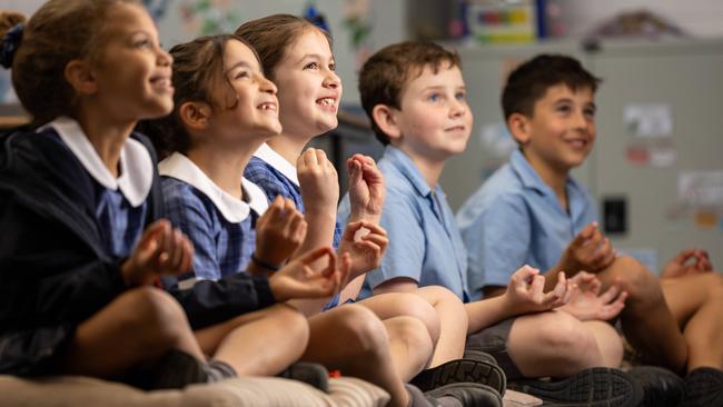 St. John Bosco's Primary School teaches kids mindfulness using Smiling Mind’s resources to boost their mental health. Picture: Jason Edwards