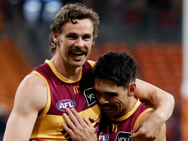 SYDNEY, AUSTRALIA - SEPTEMBER 14: Joe Daniher and Charlie Cameron of the Lions celebrate during the 2024 AFL First Semi Final match between the GWS GIANTS and the Brisbane Lions at ENGIE Stadium on September 14, 2024 in Sydney, Australia. (Photo by Dylan Burns/AFL Photos via Getty Images)