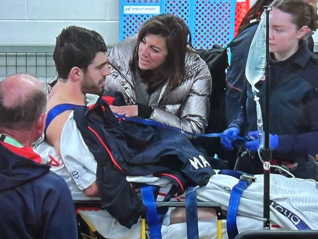 Christian Petracca on his way to hospital after an accidental knee in the ribs