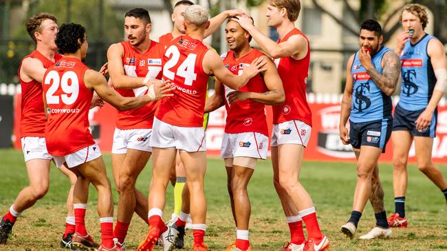 Billy Hartung (No.24) celebrates with teammates after a goal against Sturt. Picture: Morgan Sette