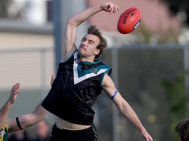 Matthew Quinton and Joshua Leather in action during the NFL football match between Laurimar and Old Eltham Collegians in Doreen, Saturday, July 6, 2019. Picture: Andy Brownbill