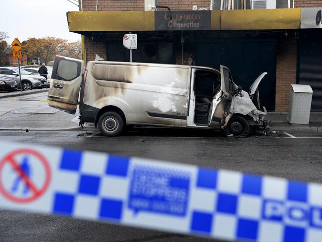 A torched van outside a tobacconist shop that was also set alight on Belair Ave, Glenroy. Picture: Andrew Henshaw