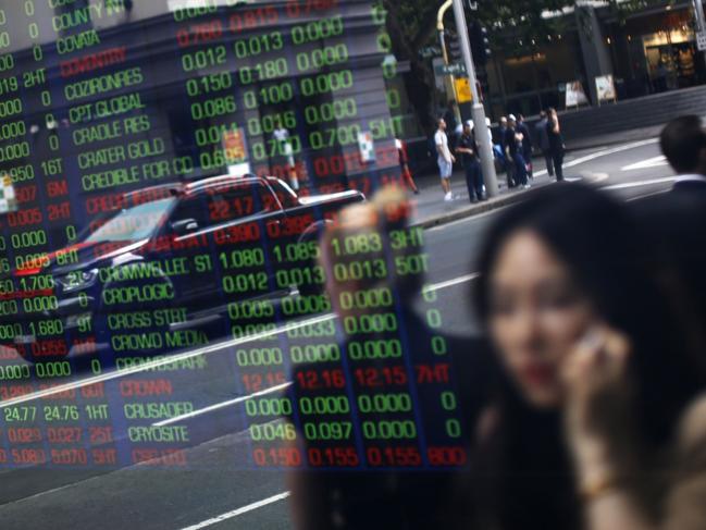 Pedestrians are reflected in a window as they walk  past an electronic stock board at the ASX Ltd. exchange centre in Sydney, Australia, on Thursday, Feb. 14, 2019. âWe made good progress on our core initiatives across the period, including the program to replace CHESS with distributed ledger technology; upgrade of our secondary data centre to strengthen market resilience; and restructure of our Listings Compliance team to enhance the quality of market oversight,â ASX Chief Executive Officer Dominic Stevens said. Photographer: David Moir/Bloombergrket resilience; and restructure of our Listings Compliance team to enhance the quality of market oversight,â ASX Chief Executive Officer Dominic Stevens said. Photographer: David Moir/Bloomberg