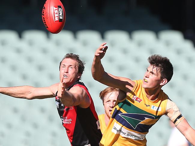 LtoR: Jason Porplyzia (West Adelaide) and Sam Rowland (Eagles) during the second quarter. West Adelaide v Eagles, at Adelaide Oval. SANFL ANZAC Day Football. 25/04/16  Picture: Stephen Laffer