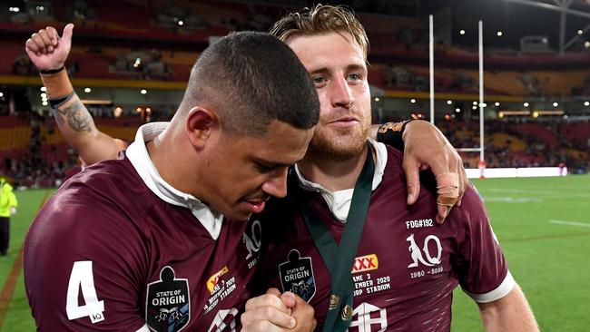 BRISBANE, AUSTRALIA - NOVEMBER 18:  Cameron Munster and  Dane Gagai of the Maroons embrace as they celebrate victory after game three of the State of Origin series between the Queensland Maroons and the New South Wales Blues at Suncorp Stadium on November 18, 2020 in Brisbane, Australia. (Photo by Bradley Kanaris/Getty Images)