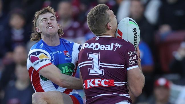 SYDNEY, AUSTRALIA - JULY 14: Tom Trbojevic of the Sea Eagles scores a try during the round 19 NRL match between Manly Sea Eagles and Newcastle Knights at 4 Pines Park on July 14, 2024 in Sydney, Australia. (Photo by Jason McCawley/Getty Images)