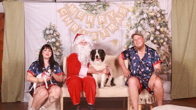 Kira-Lee and Kelly Ball with their pooches, Lilly the foxie and Archie the border collie with Santa: photo taken by the Central Queensland Animal Society at the PCYC Rockhampton.