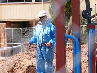 Asbestos removalists are digging up the oval and playgrounds of Warwick Central State School in a bid to give parents, students and staff peace of mind after asbestos was found in the grounds. Picture: Marian Faa