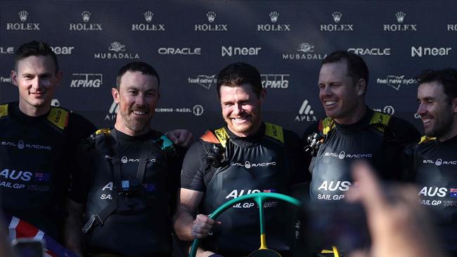 Tom Slingsby (C) celebrates victory with teammates at the end of final race of the Sail Grand Prix event on Sydney Harbour on February 25, 2024.