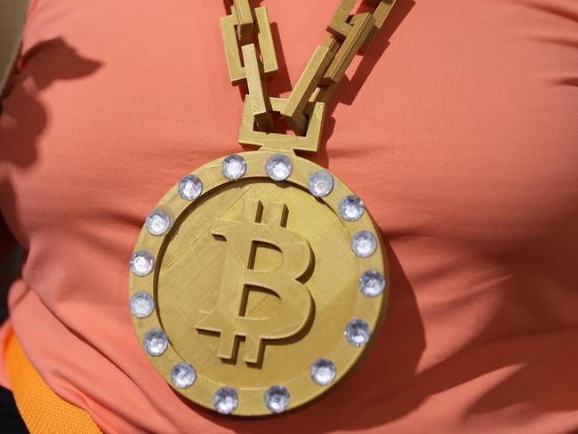 MIAMI, FLORIDA - JUNE 04: An attendee wears a necklace at the Bitcoin 2021 Convention, a crypto-currency conference held at the Mana Convention Center in Wynwood on June 04, 2021 in Miami, Florida. The crypto conference is expected to draw 50,000 people and runs from Friday, June 4 through June 6th.   Joe Raedle/Getty Images/AFP == FOR NEWSPAPERS, INTERNET, TELCOS & TELEVISION USE ONLY ==