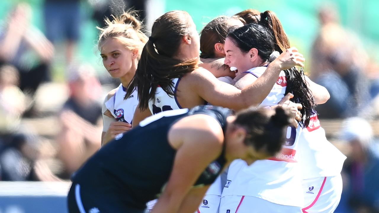 Fremantle players celebrate on the final siren as it was heartbreak for Carlton. Picture: Getty