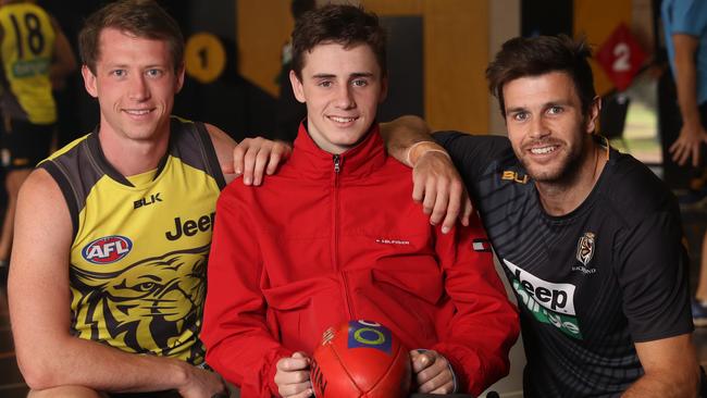 Will visits with Dylan Grimes and Trent Cochin at Punt Rd Oval. Picture: Alex Coppel.