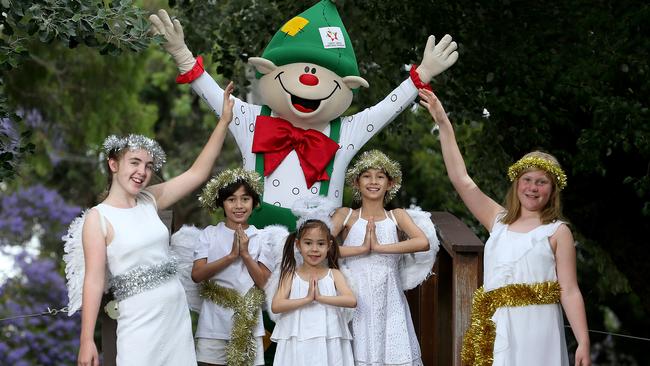 Charlotte, Zac, Scarlett, Maddy, Louisa and Jolly the elf at a previous Carols by the Creek Picture: Dylan Coker