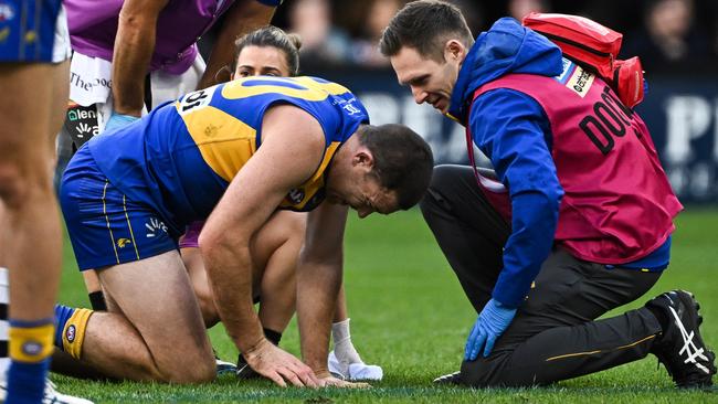 Jeremy McGovern grimaces after injuring his ribs. Picture: Daniel Carson/AFL Photos via Getty Images