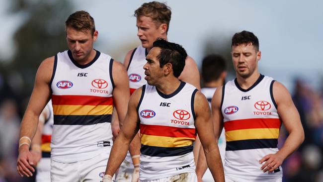 Daniel Talia, Alex Keath, Eddie Betts and Luke Brown commiserate after the loss against Western Bulldogs in their final game of the season. Picture: AAP Image/Scott Barbour