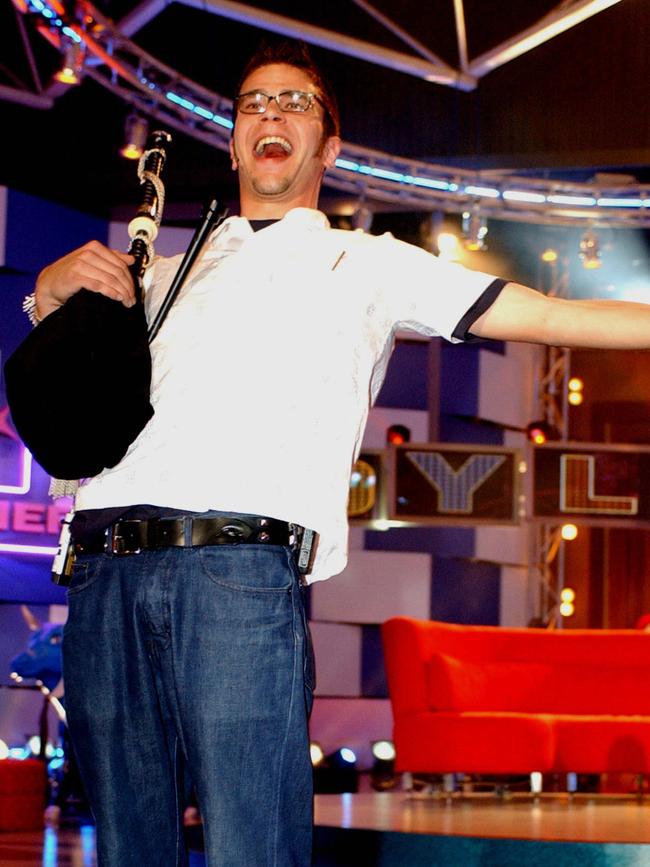 TV personality Dylan Lewis on stage at DreamWorld on the Gold Coast 12/08/02 after being named winner of Celebrity Big Brother.