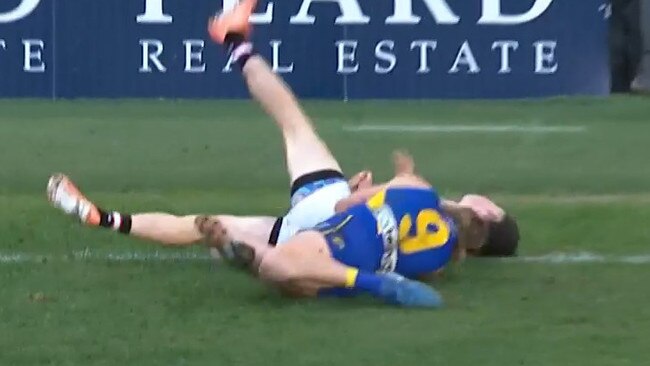 Harley Reid sling tackles Darcy Wilson to the turf.