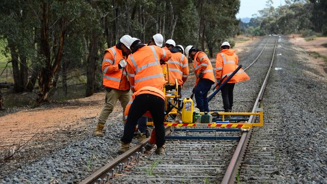 Work being carried out as part of the Murray Basin Rail Project, which recently upgraded the Mildura line for freight services. Picture: Zoe Phillips