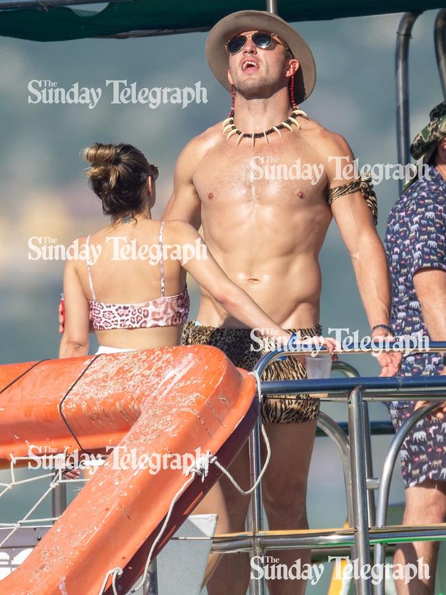 The NRL star soaks up some sun while partying on the boat. Picture: Backgrid