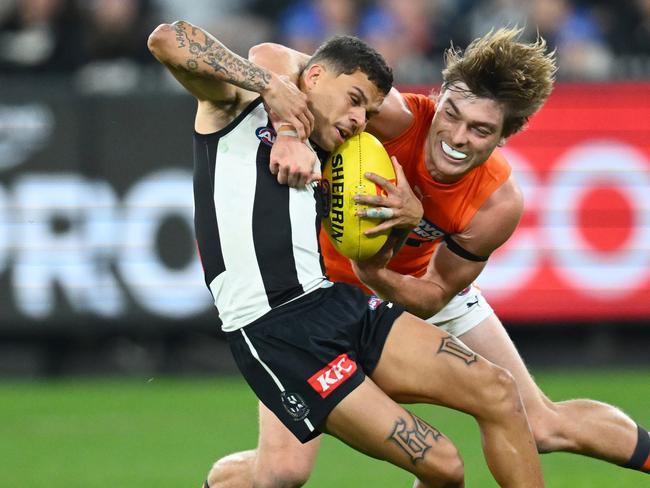 MELBOURNE, AUSTRALIA - MAY 14: Bobby Hill of the Magpies is tackled by Cameron Fleeton of the Giants during the round nine AFL match between Collingwood Magpies and Greater Western Sydney Giants at Melbourne Cricket Ground, on May 14, 2023, in Melbourne, Australia. (Photo by Quinn Rooney/Getty Images)