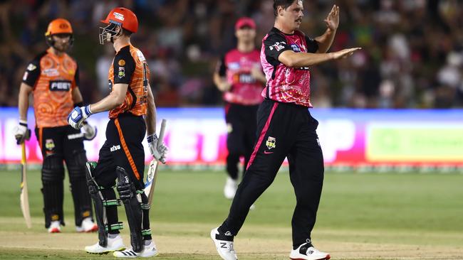 Ben Dwarshuis celebrates dismissing Cameron Bancroft during the men's Big Bash League match between the Sydney Sixers and the Perth Scorchers at Coffs Harbour on January 9. Picture: Chris Hyde/Getty Images