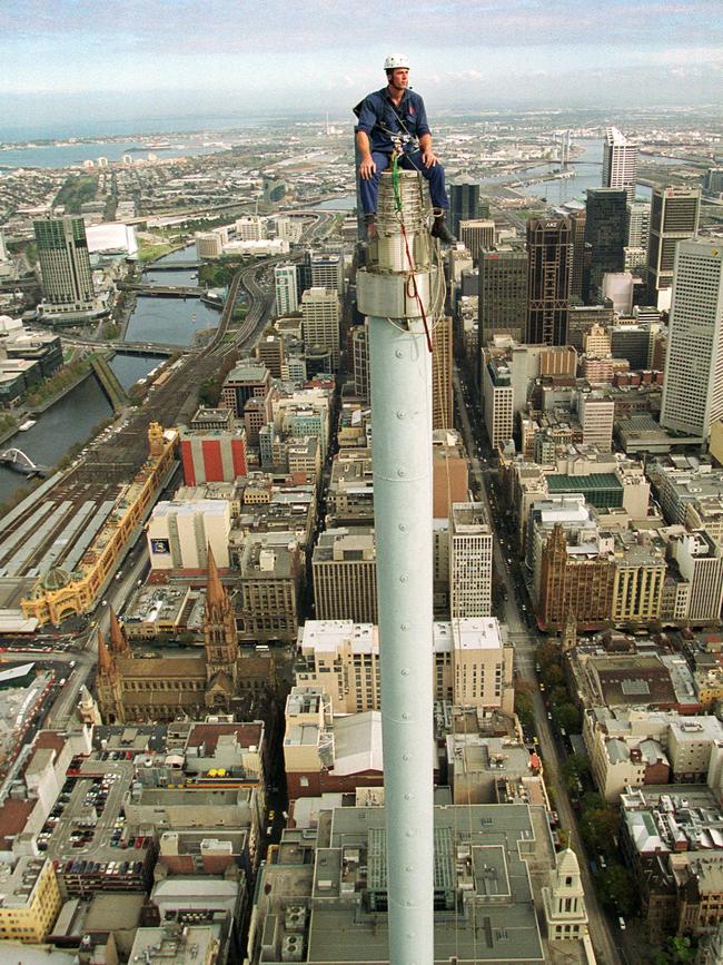 Sometimes you have to go to great lengths, or in this case heights, to get a good picture. Craig Borrow braved dizzying heights to snap Chris Davies, of Victorian Rope Access, changing lights on top of the mast at the 101 Collins St building.