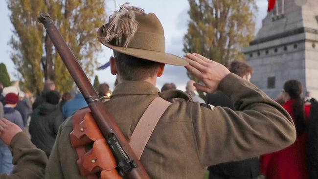 Members of C squadron, 3rd Lighthorse Regiment, Historic Troop salute when The Ode is played at the Anzac day dawn service at the Hobart cenotaph. Picture: PATRICK GEE