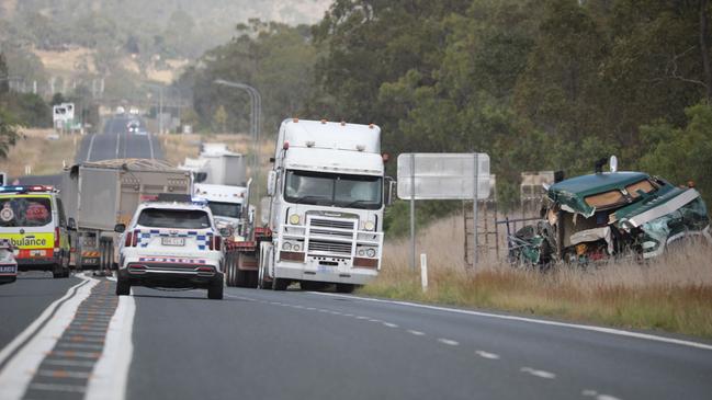 Emergency services at the scene of a two-truck crash on the Capricorn Highway at Kabra.