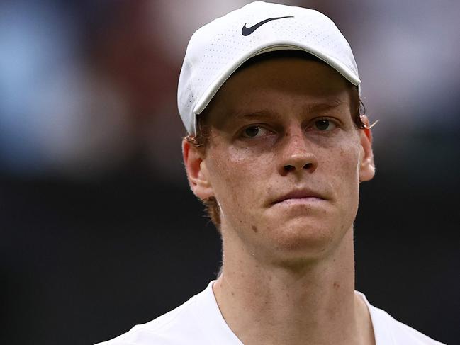 Italy's Jannik Sinner reacts after losing against Russia's Daniil Medvedev during their men's singles quarter-final tennis match on the ninth day of the 2024 Wimbledon Championships at The All England Lawn Tennis and Croquet Club in Wimbledon, southwest London, on July 9, 2024. Medvedev won the match 6-7, 6-4, 7-6, 2-6 6-3. (Photo by HENRY NICHOLLS / AFP) / RESTRICTED TO EDITORIAL USE