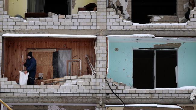 A man cleans and repairs his home after shelling in Borodyanka, Ukraine. Picture: Getty Images.