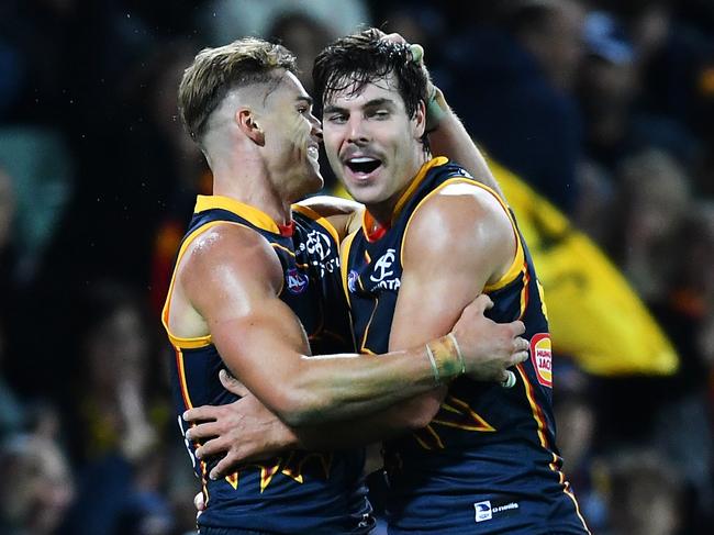 ADELAIDE, AUSTRALIA - APRIL 13: Darcy Fogarty of the Crows celebrates a goal  with Ben Keays of the Crows during the round five AFL match between Adelaide Crows and Carlton Blues at Adelaide Oval, on April 13, 2023, in Adelaide, Australia. (Photo by Mark Brake/Getty Images)